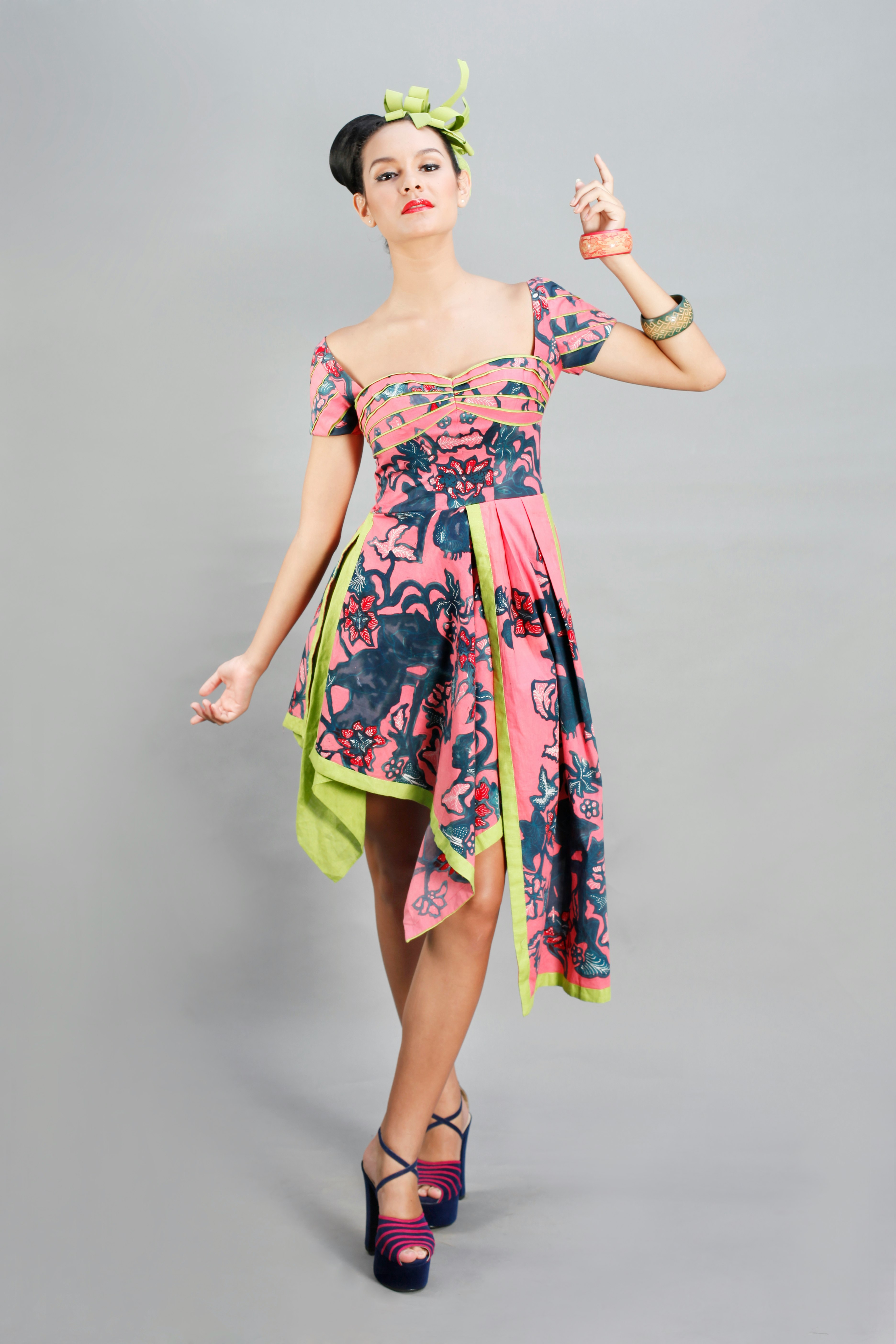woman in pink green and yellow floral dress